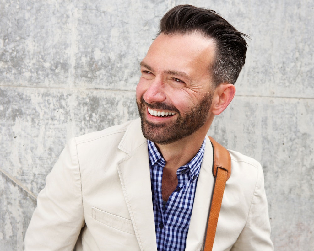 Man smiling and looking left