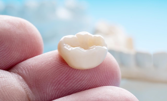 Dental crown on finger