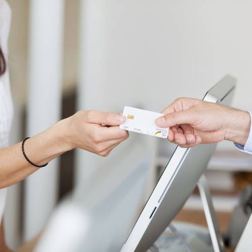 Patient paying for dental care