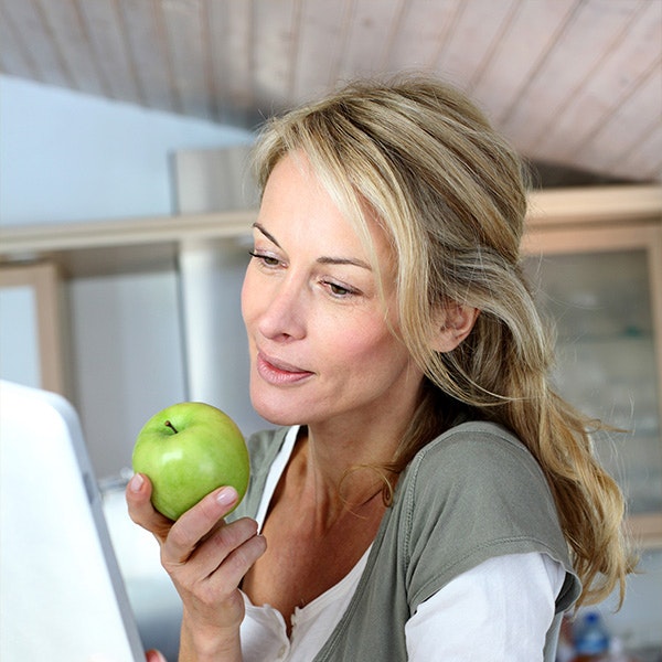 Woman holding apple